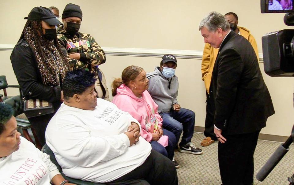 GBI Special Agent in Charge Jerry Jones speaks with the family of Derrick Stallings Tuesday morning in the Crawford County courthouse.