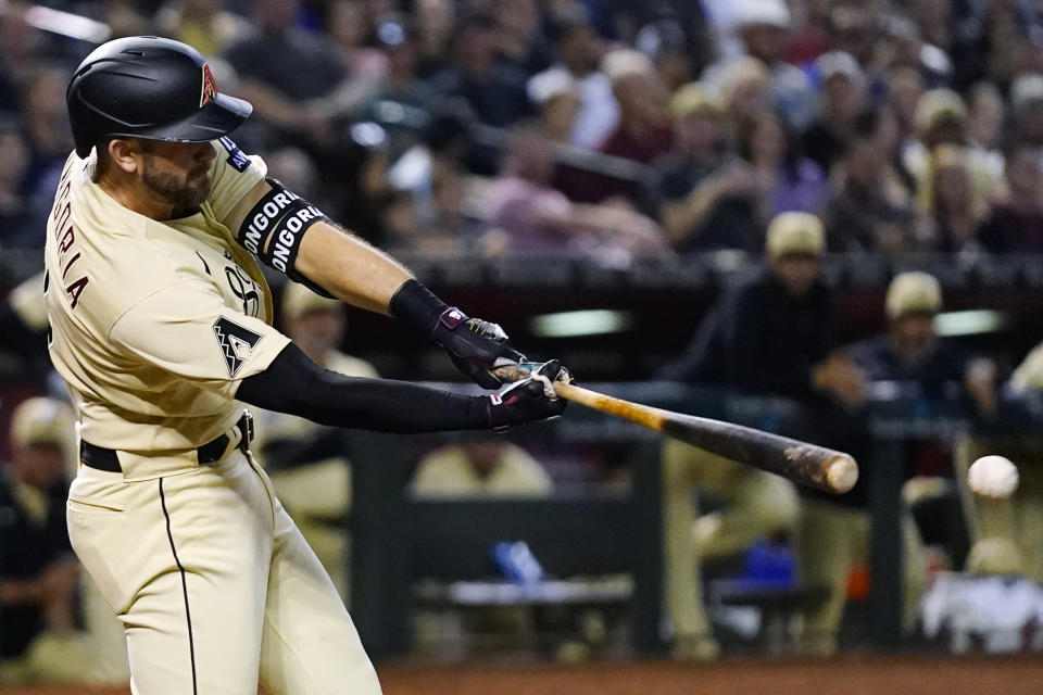 Arizona Diamondbacks' Evan Longoria hits a double against the Los Angeles Dodgers during the eighth inning of a baseball game Friday, April 7, 2023, in Phoenix. The Diamondbacks won 6-3. (AP Photo/Ross D. Franklin)