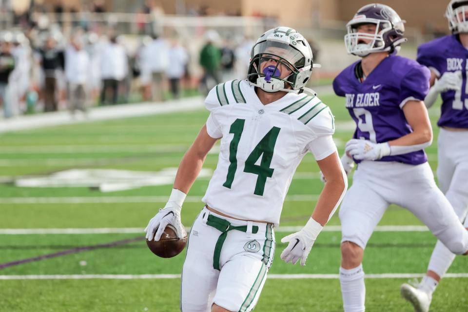 Olympus’ Caden Lloyd celebrates after making a catch and running the ball for a touchdown in a 5A quarterfinal high school football game against Box Elder in Brigham City on Friday, Nov. 3, 2023. | Spenser Heaps, Deseret News