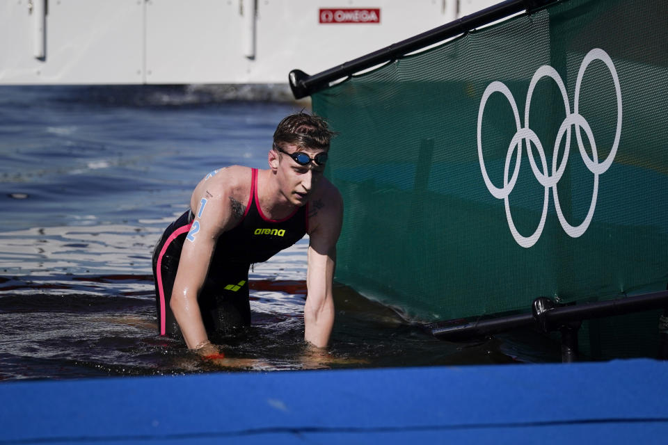 Florian Wellbrock, of Germany, crawls out of the water after winning the men's marathon swimming event at the 2020 Summer Olympics, Thursday, Aug. 5, 2021, in Tokyo, Japan. (AP Photo/Jae C. Hong)