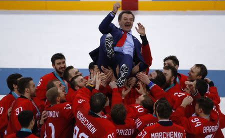 Ice Hockey - Pyeongchang 2018 Winter Olympics - Men Final Match - Olympic Athletes from Russia v Germany - Gangneung Hockey Centre, Gangneung, South Korea - February 25, 2018 - Olympic Athlete from Russia coach Oleg Znarok is lifted up. REUTERS/Brian Snyder