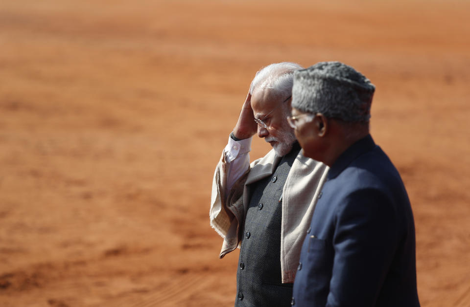 Indian Prime Minister Narendra Modi, left, and Indian President Ram Nath Kovind wait for the arrival of Brazilian President Jair Bolsonaro, at the presidential palace in New Delhi, India, Saturday, Jan. 25, 2020. Bolsonaro is this year's chief guest for India's Republic day parade. (AP Photo/Manish Swarup)