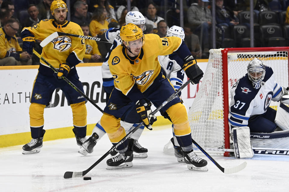 Nashville Predators center Ryan Johansen (92) looks to pass the puck during the second period of the team's NHL hockey game against the Winnipeg Jets on Tuesday, Jan. 24, 2023, in Nashville, Tenn. (AP Photo/Mark Zaleski)