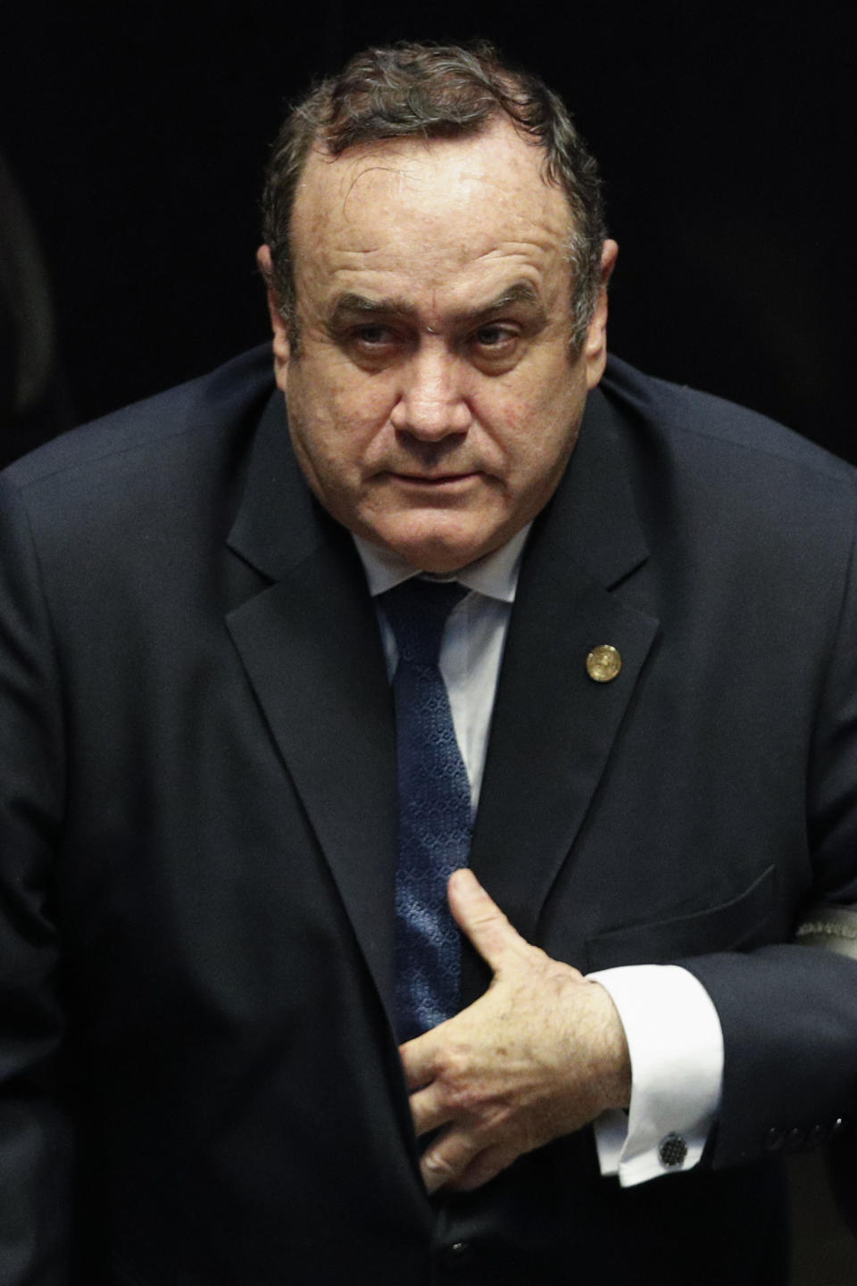 Guatemala's President Alejandro Giammattei stands as he is welcomed to the Mexican Senate, in Mexico City, Thursday, Feb. 6, 2020. (AP Photo/Rebecca Blackwell)