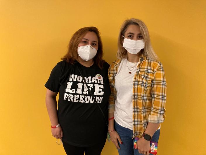 Nilou, left, an electrical engineering student pursuing her PhD, and Maryam, right, a psychology graduate student, pose for a photo at the UW-Milwaukee Student Union on Nov. 15. The two organized a demonstration against the Iranian government.