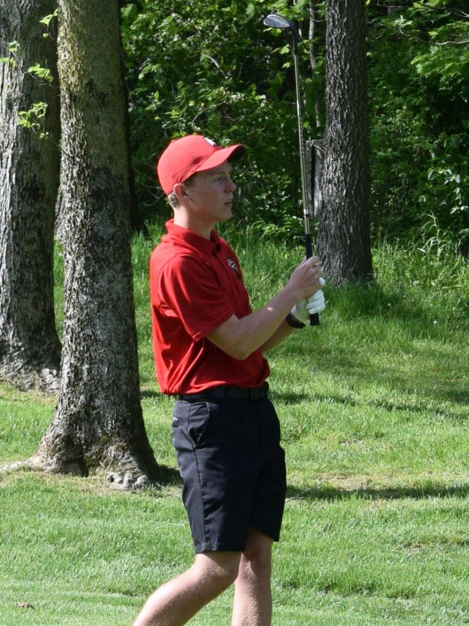 Edgewood sophomore Luke Garrett watches his shot fly through the air during his team's dual match against Monrovia. (Seth Tow/Herald-Times)