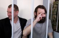 Crew members of Ukrainian naval ships, which were seized by Russia's FSB security service in November 2018, attend a court hearing in Moscow