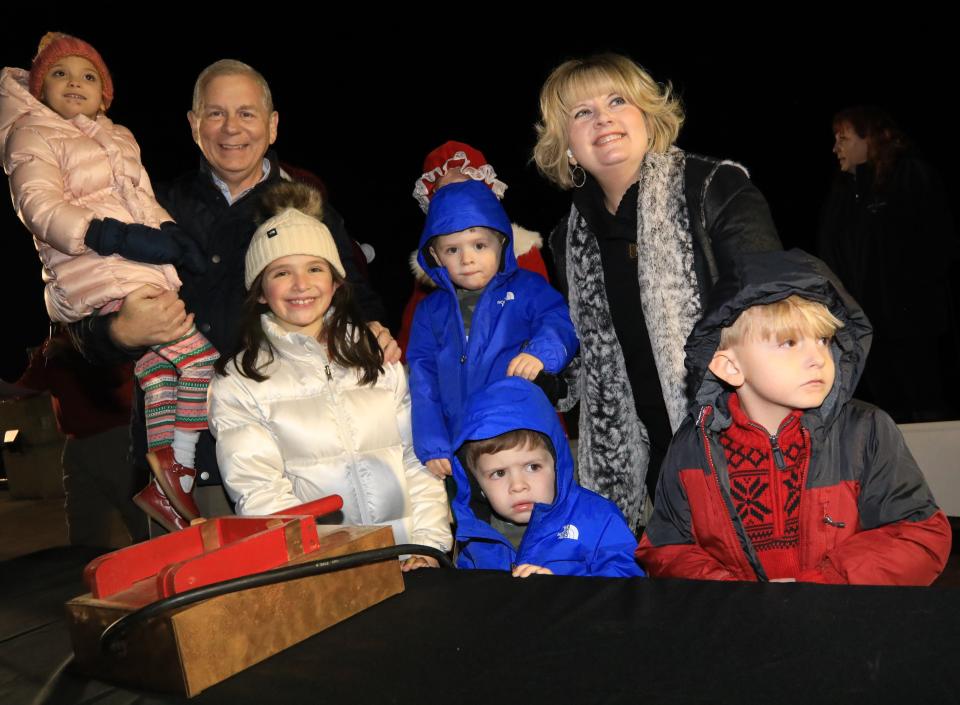 Mayor Joe Pitts and First Lady Cynthia Pitts illuminating McGregor Park's Christmas lights with grandkids Vivie Grace, Eva Roman Maddox and Noah.