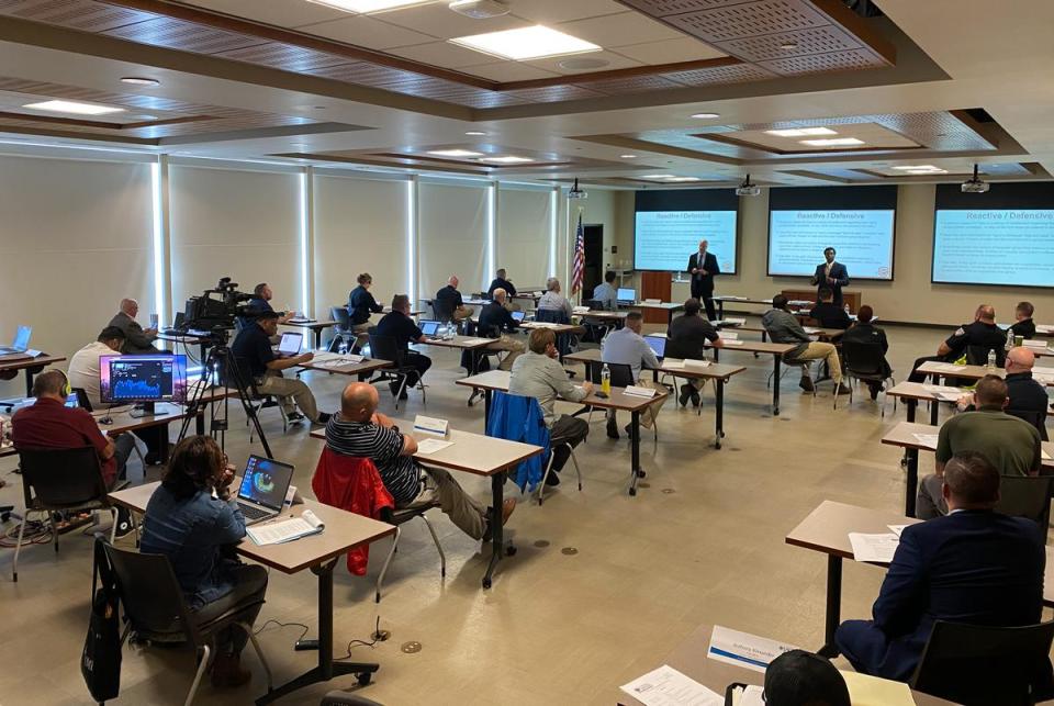 Arlington Police Department corporals Chris Holder and Jastin Williams lead a training about hate crimes with police officers in Nashville on May 3, 2021. The corporals now travel the country offering the course to various agencies. <cite>Credit: Courtesy of Arlington Police Department</cite>