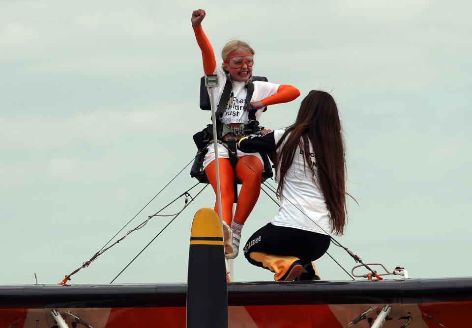 Nine-year-old Rose Powell prepares to go wing-walking over Rendcomb Airfield near Cirencester for the charity Duchenne Children's Trust.