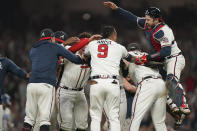 Atlanta Braves celebrate after winning Game 6 of baseball's National League Championship Series against the Los Angeles Dodgers Sunday, Oct. 24, 2021, in Atlanta. The Braves defeated the Dodgers 4-2 to win the series. (AP Photo/Brynn Anderson)