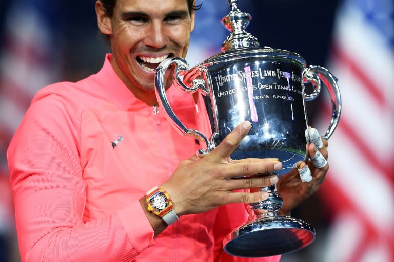 Defending champion: Rafael Nadal poses with his winning trophy in 2017