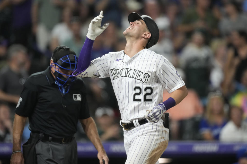 Colorado Rockies' Nolan Jones gestures as he crosses home plate after hitting a three-run home run off Toronto Blue Jays relief pitcher Genesis Cabrera in the sixth inning of a baseball game Friday, Sept. 1, 2023, in Denver. (AP Photo/David Zalubowski)