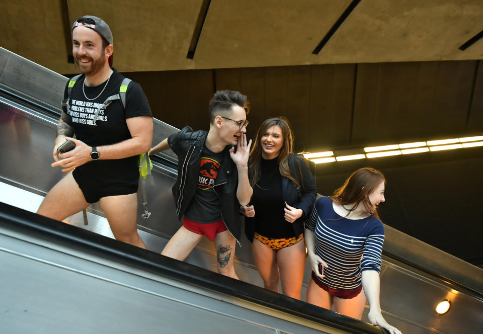 People on an escalator on the Underground as they take part in the No Trousers Tube Ride in London. (Photo: Dominic Lipinski/PA Images via Getty Images)