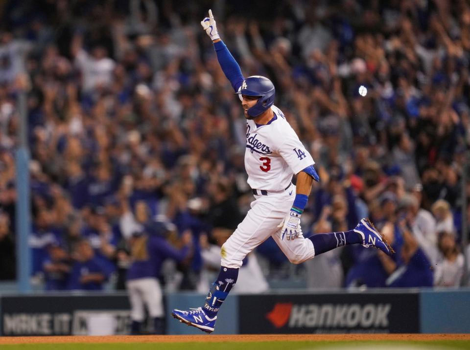 Dodgers' Chris Taylor rounds the bases after hitting a 2-run walk-off home run against the Cardinals in the National League Wild Card Game in 2021.