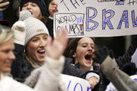 Basaeball fans cheer ahead of a victory parade, Friday, Nov. 5, 2021, in Atlanta. The Braves beat the Houston Astros 7-0 in Game 6 on Tuesday to win their first World Series baseball title in 26 years. (AP Photo/Brynn Anderson)