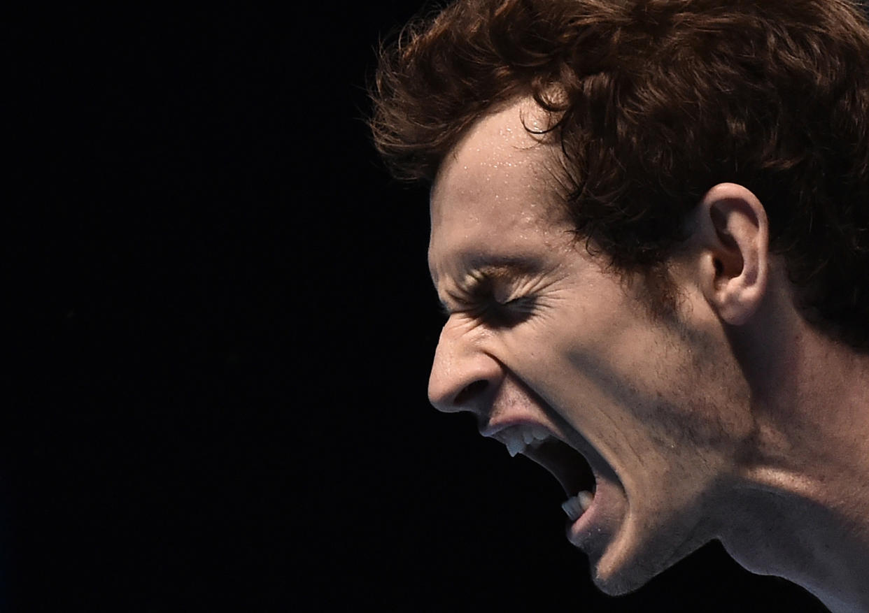 Andy Murray of Britain reacts after gaining match point during his tennis match against Milos Raonic of Canada at the ATP World Tour finals at the O2 Arena in London November 11, 2014. REUTERS/Toby Melville (BRITAIN - Tags: SPORT TENNIS TPX IMAGES OF THE DAY)