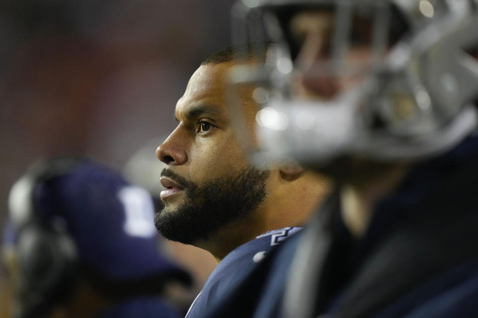 Dallas Cowboys quarterback Dak Prescott (4) watching the action from the sidelines during the second half an NFL football game against the Washington Commanders, Sunday, Jan. 8, 2023, in Landover, Md. Washington won 26-6. (AP Photo/Alex Brandon)