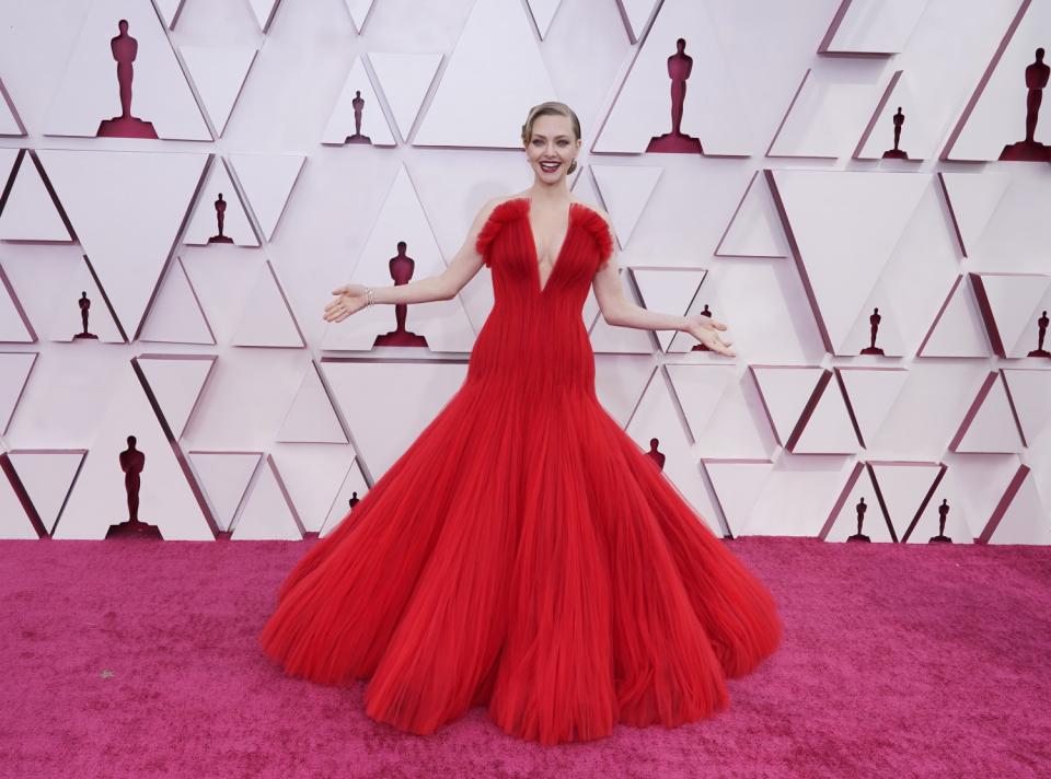 Amanda Seyfried in a red dress with a voluminous skirt