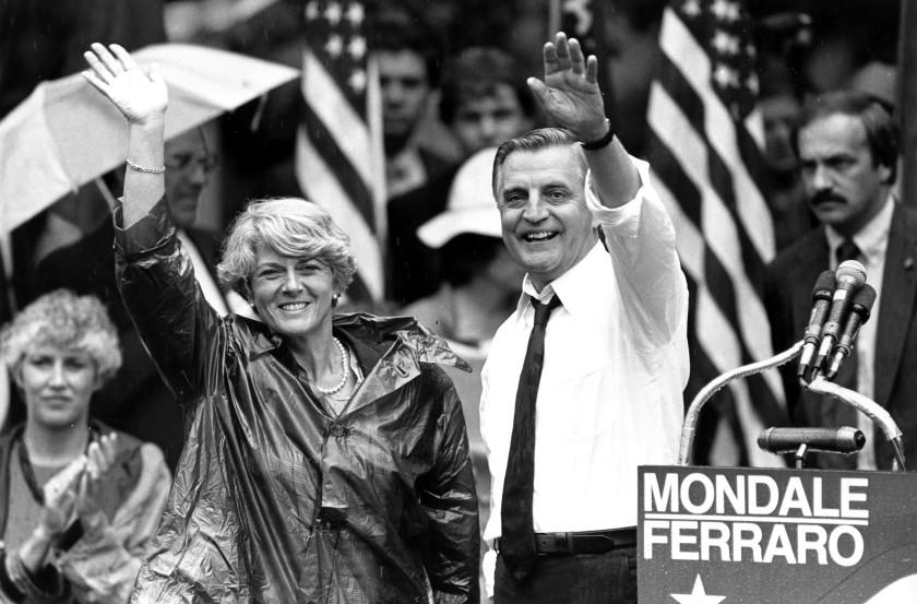 FILE - In this Wednesday, Sept. 5, 1984, file photo, Democratic presidential candidate Walter Mondale and his running mate, Geraldine Ferraro, wave as they leave an afternoon rally in Portland, Ore. Mondale, a liberal icon who lost the most lopsided presidential election after bluntly telling voters to expect a tax increase if he won, died Monday, April 19, 2021. He was 93. (AP Photo/Jack Smith, File)