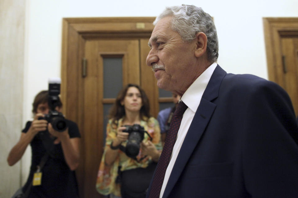 Fotis Kouvelis, right, whose Democratic Left party is a junior partner in Greece's governing coalition, enters Prime Minister Antonis Samaras' office inside the Greek Parliament, in Athens, Tuesday, Oct. 16, 2012. Greece has been surviving on emergency loans from eurozone countries and the International Monetary Fund for more than two years. It is currently locked in protracted negotiations with rescue creditors for a major new austerity package that is set to take the country into a sixth year of recession in 2013. (AP Photo/Petros Giannakouris)