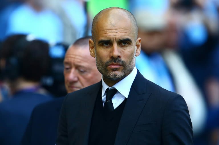 Manchester City's manager Pep Guardiola reacts ahead of the English Premier League football match against Hull City April 8, 2017