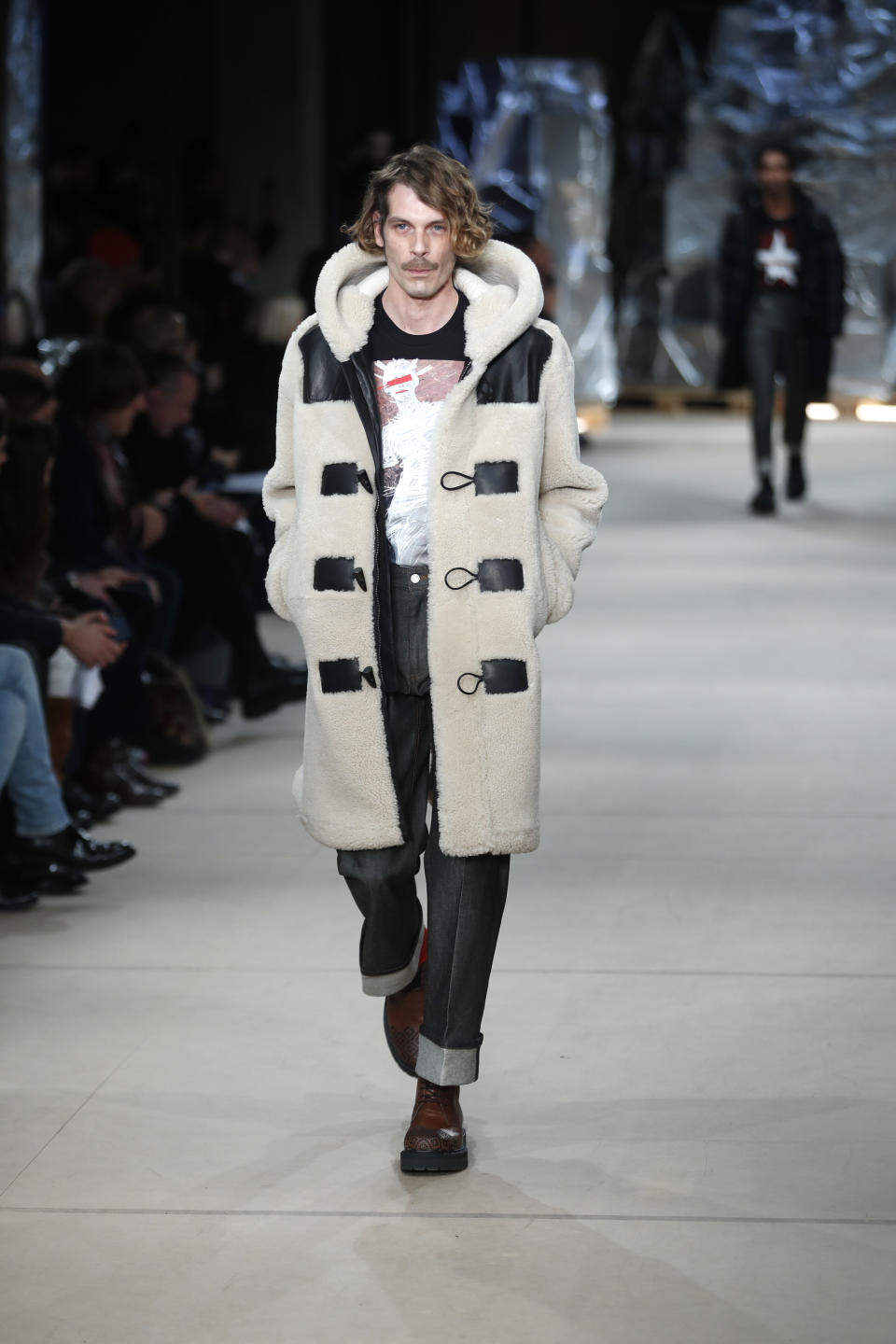 A model wears a creation as part of the Neil Barrett men's Fall-Winter 2020/21 collection, that was presented in Milan, Italy, Saturday, Jan. 11, 2020. (AP Photo/Antonio Calanni)