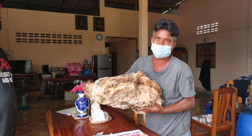 Narong Phetcharaj posing with the ambergris whale vomit.