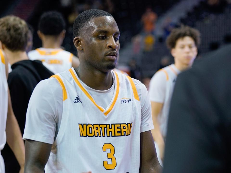 Northern Kentucky's Marques Warrick (3) is greeted by his teammates after he passed Drew McDonald to become the Norse's all-time leading scorer in a game against Detroit Mercy on Feb. 10, 2024.