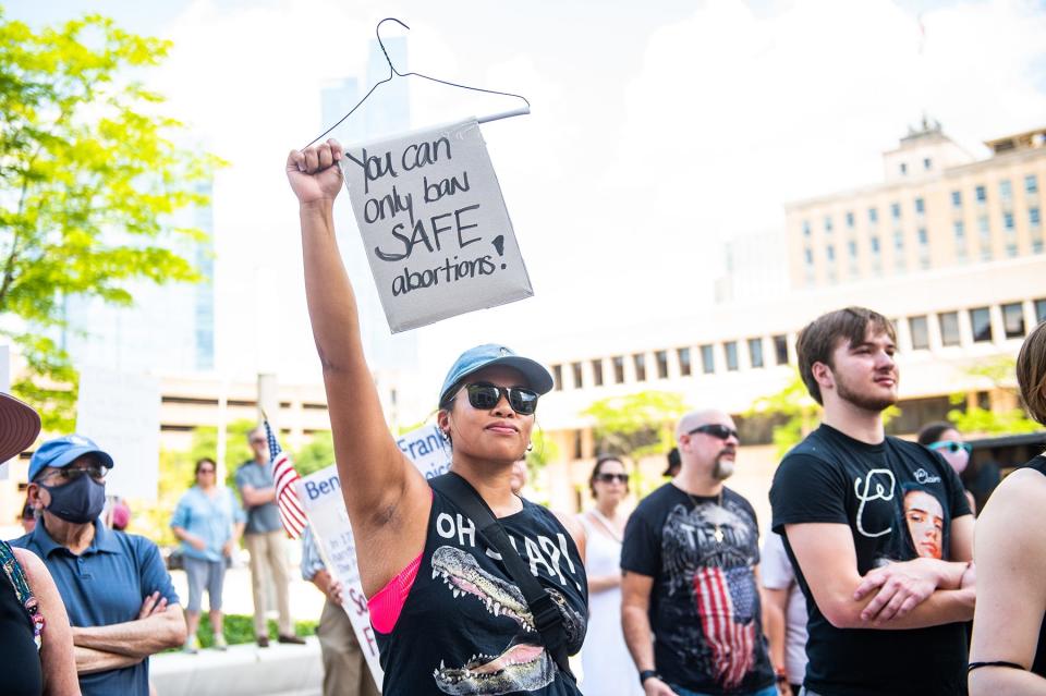 Samantha Bruno of Mamaroneck holds a hanger with the sign "you can only ban safe abortions" attached during the in support of Roe v. Wade rally in White Plains, NY on Sunday, June 26, 2022. KELLY MARSH/FOR THE JOURNAL NEWS