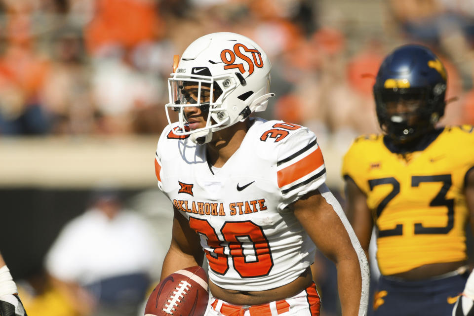 Oklahoma State running back Chuba Hubbard (30) walks the field during an NCAA college football game Saturday, Sept. 26, 2020, in Stillwater, Okla. (AP Photo/Brody Schmidt)