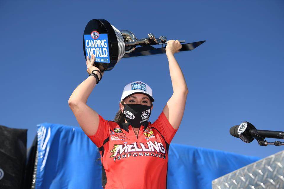 In this photo provided by the NHRA, Erica Enders earned her fourth world title and went on to win the race at the Dodge NHRA Finals presented by Pennzoil when she went 6.643 seconds at 206.39 mph to beat Kyle Koretsky in the final Sunday, Nov. 1, 2020, in Las Vegas. (Jerry Foss/NHRA via AP)