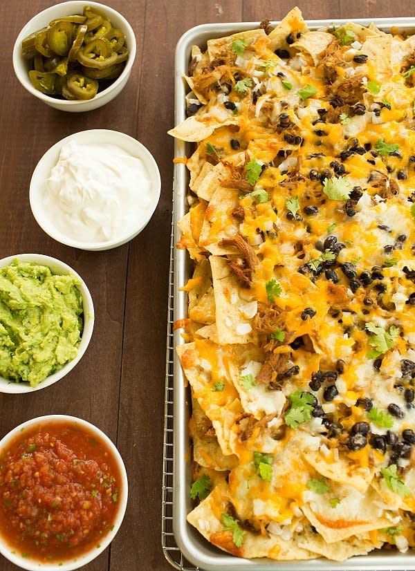 <strong>Get the <a href="https://www.browneyedbaker.com/ultimate-nachos-with-beer-braised-carnitas/" target="_blank">Ultimate Nachos With Beer Braised Carnitas</a> from Brown Eyed Baker</strong>