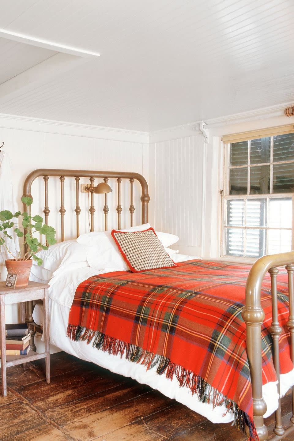 <p>Even your bedroom could use a winter refresh: Keep it simple by dressing the bed with a plaid throw pillow and coordinating blanket. </p>