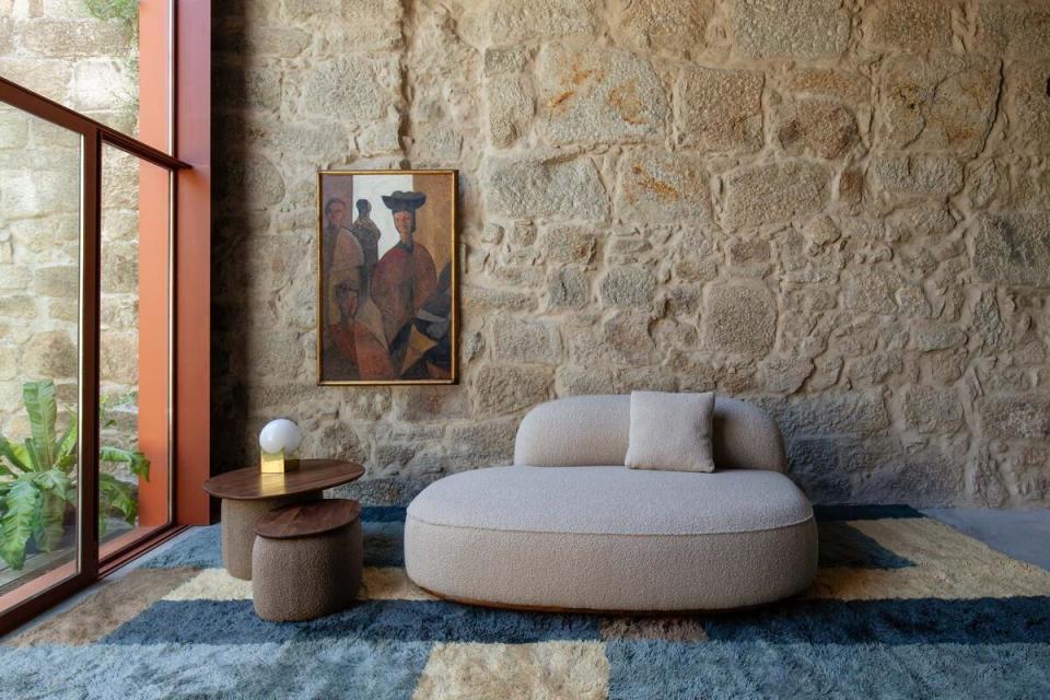 The Jorge armless sofa and Maria Medium side table by Luca Nichetto for De La Espada