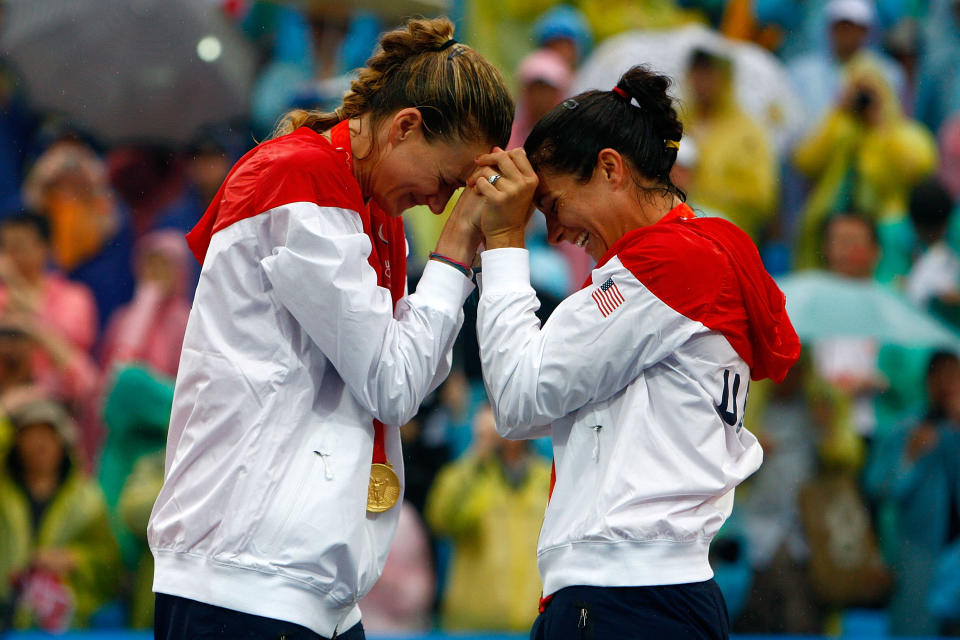 Gold medalists Kerri Walsh and Misty May-Treanor of the United States celebrate after winning the women's gold medal match against China held at the Chaoyang Park Beach Volleyball Ground during Day 13 of the Beijing 2008 Olympic Games on August 21, 2008 in Beijing, China. (Photo by Jamie Squire/Getty Images)