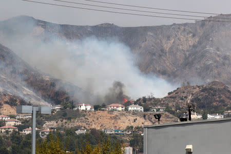 The La Tuna Canyon fire over Burbank, California, September 2, 2017. REUTERS/Kyle Grillot