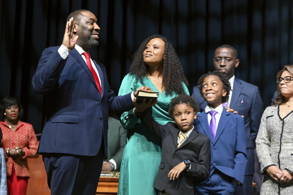 Kenyatta Johnson, with his wife, Dawn Chavous, center, and their sons, right, takes the oath of office as president of Philadelphia City Council president during inauguration ceremonies, Tuesday, Jan. 2, 2024, at the Met in Philadelphia. Mayor Cherelle Parker is at left. (Tom Gralish/The Philadelphia Inquirer via AP)