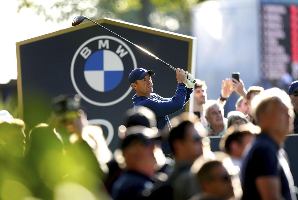 Northern Ireland's Rory McIlroy tees off on the third, during day one of the PGA Championship at Wentworth Golf Club in Virginia Water, Surrey, England, Thursday, Sept. 14, 2023. (Zac Goodwin/PA via AP)