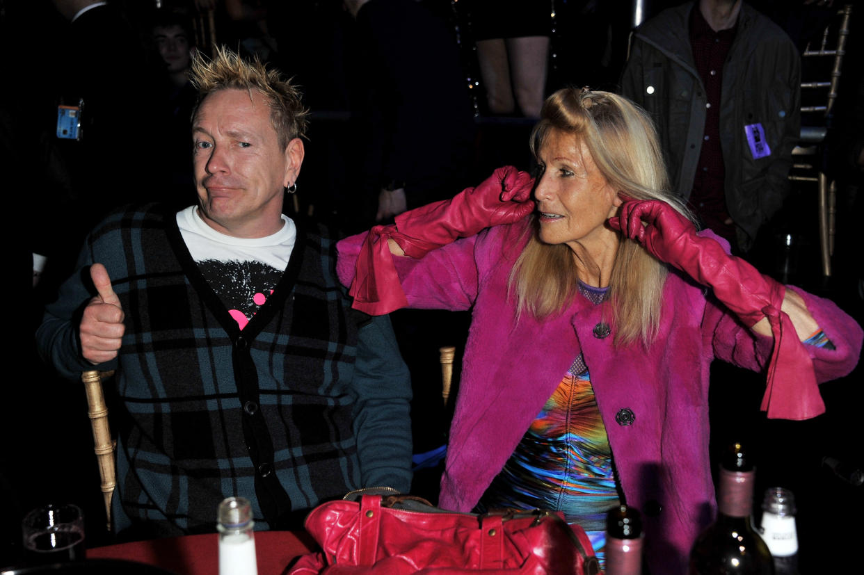 LONDON, ENGLAND - FEBRUARY 23:  John Lydon and Nora Forster share a joke at their table at the NME Awards 2011 at Brixton Academy on February 23, 2011 in London, England.  (Photo by Jon Furniss/WireImage)