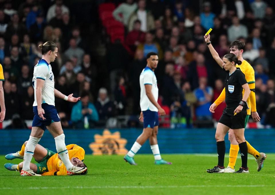 Referee Stephanie Frappart shows a yellow card to England's Conor Gallagher (PA)