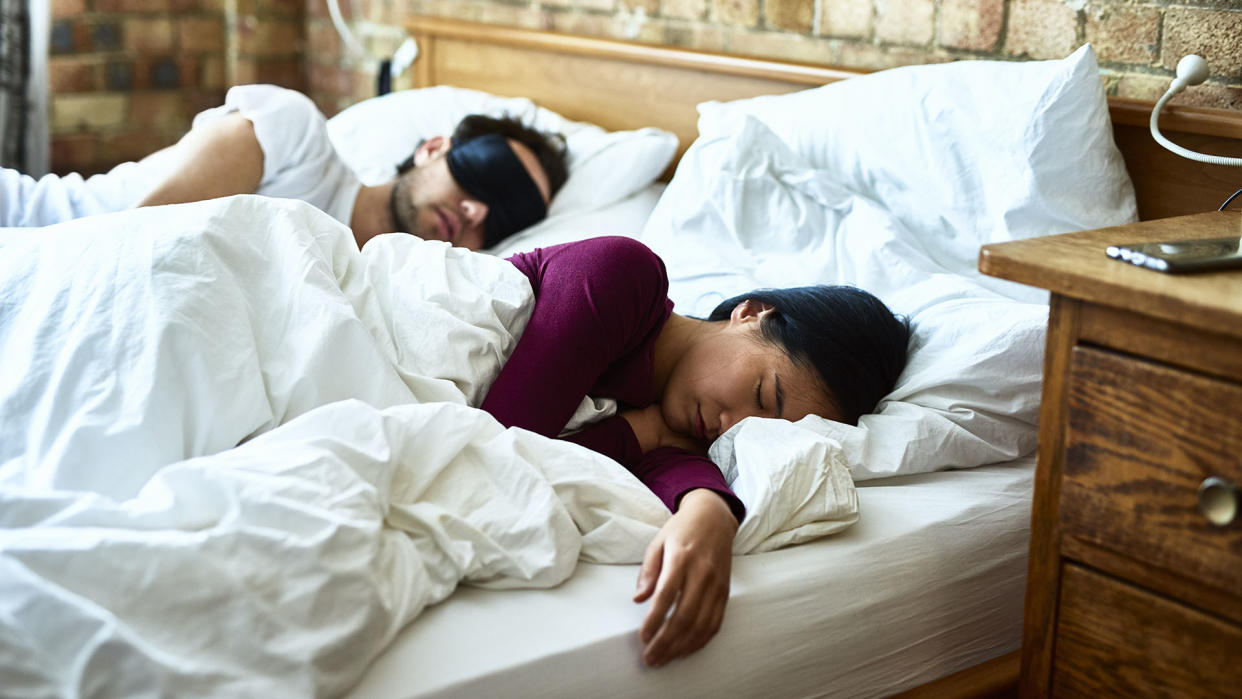  Couple asleep in bed 