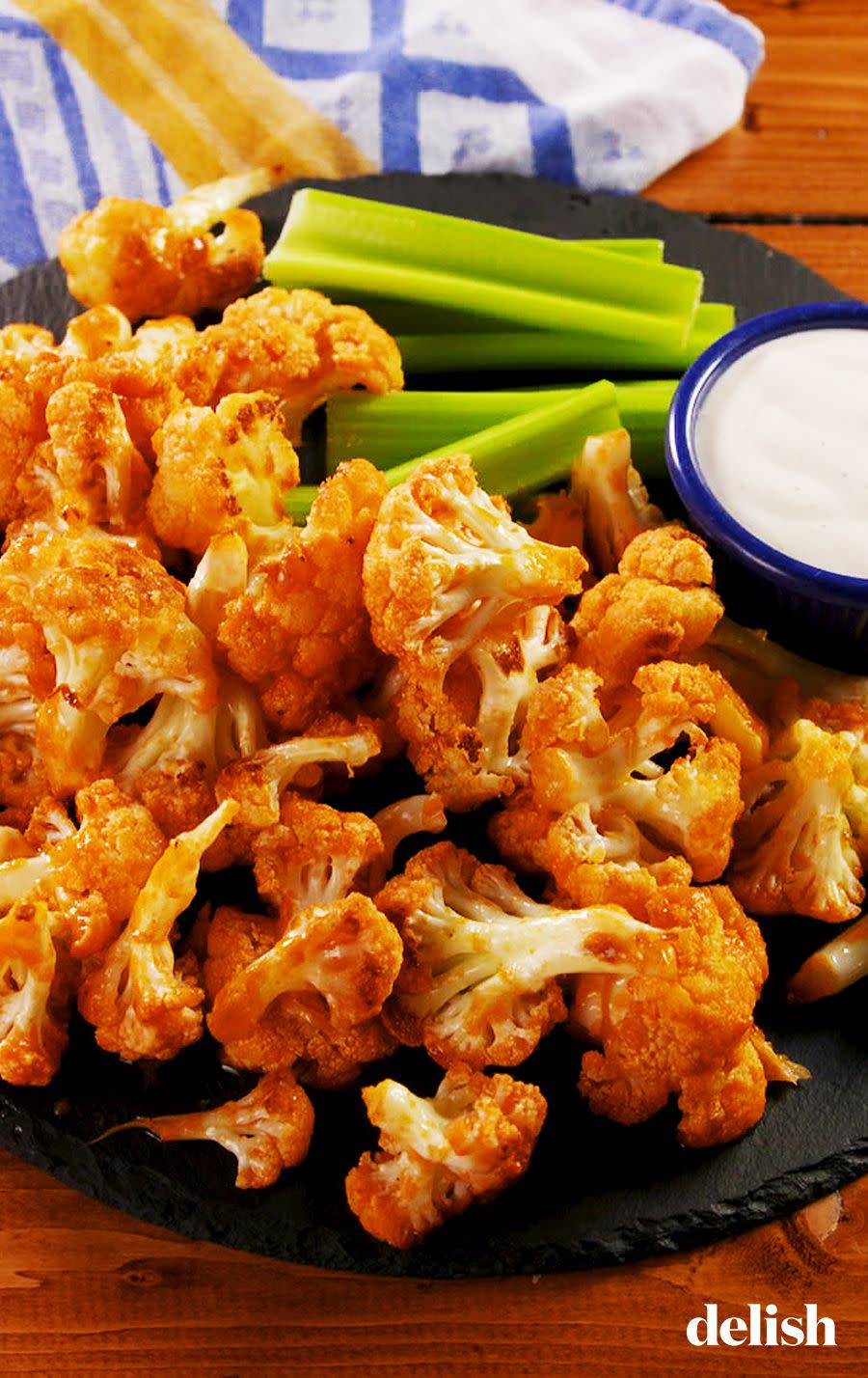 <p><a href="https://www.delish.com/cooking/recipe-ideas/recipes/a51133/classic-buffalo-wings-recipe/" rel="nofollow noopener" target="_blank" data-ylk="slk:Buffalo chicken wings;elm:context_link;itc:0;sec:content-canvas" class="link ">Buffalo chicken wings</a> who? This vegetarian version of everyone's favorite football snack will satisfy everyone and taste just as amazing with <a href="https://www.delish.com/cooking/recipe-ideas/a25634518/ranch-dressing-recipe/" rel="nofollow noopener" target="_blank" data-ylk="slk:ranch dressing;elm:context_link;itc:0;sec:content-canvas" class="link ">ranch dressing</a> (or <a href="https://www.delish.com/cooking/recipe-ideas/a38768697/blue-cheese-dressing-recipe/" rel="nofollow noopener" target="_blank" data-ylk="slk:blue cheese dressing;elm:context_link;itc:0;sec:content-canvas" class="link ">blue cheese dressing</a> if you like it a little funky). </p><p>Get the <strong><a href="https://www.delish.com/cooking/recipe-ideas/a25847433/buffalo-cauliflower-bites-recipe/" rel="nofollow noopener" target="_blank" data-ylk="slk:Buffalo Cauliflower Bites recipe;elm:context_link;itc:0;sec:content-canvas" class="link ">Buffalo Cauliflower Bites recipe</a>.</strong></p>