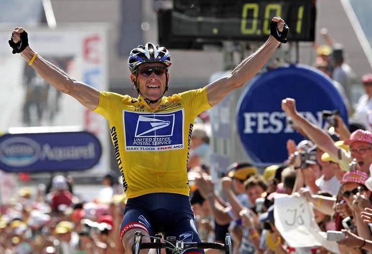 US cyclist Lance Armstrong celebrates as he crosses the finish line and wins the Tour de France on July 22, 2004. The disgraced cyclist will talk about the doping scandal that brought down his cycling career during an interview with Oprah Winfrey next week