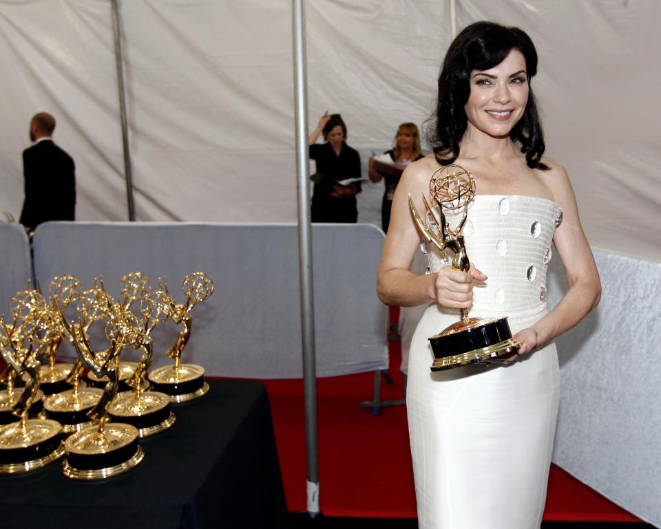 Actress Julianna Margulies is seen backstage after winning the award for outstanding lead actress in a drama series at the 2011 Primetime Emmy Awards. Margulies will be the emcee March 2 at amFAR's third Palm Beach gala.