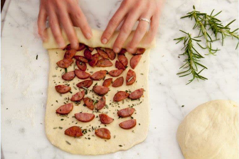 <p><em>Pão de calabresa, </em>or rolled sausage bread, is a traditional Brazilian bread baked inside a tube mold or bunt pan. Roll up <em>linguiça</em> <em>calabresa</em><em>, </em>a popular Brazilian sausage, in dough with a sprinkle of rosemary and enjoy!<strong> <a rel="nofollow noopener" href="http://www.thedailymeal.com/recipes/rolled-sausage-bread-rosemary-recipe?referrer=yahoo&category=beauty_food&include_utm=1&utm_medium=referral&utm_source=yahoo&utm_campaign=feed" target="_blank" data-ylk="slk:Find the Pão de Calabresa recipe here.;elm:context_link;itc:0;sec:content-canvas" class="link ">Find the Pão de Calabresa recipe here.</a></strong></p>