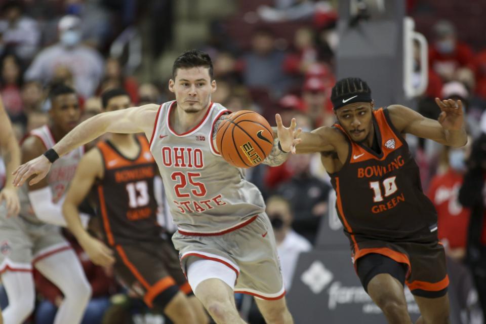 Ohio State Buckeyes forward Kyle Young (25) races for the ball against Bowling Green Falcons guard Cam Young (10) during the second half of the NCAA basketball game at the Schottenstein Center in Columbus, Ohio Nov. 15. 