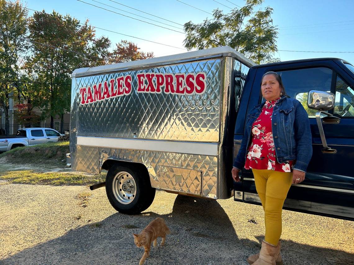 Romelia Fabián, 55, stands next to the truck she uses for her business, Tamales Express. Fabián has sold tamales outside of Los Primos Supermarket in East Durham for 15 years.