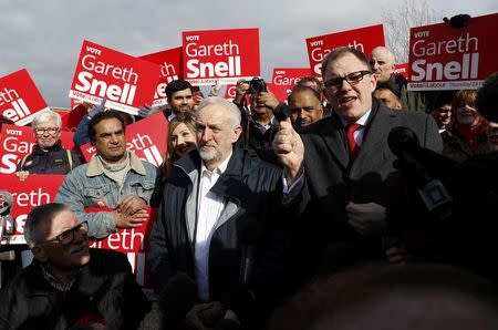 Jeremy Corbyn, the leader of Britain's opposition Labour Party, speaks to supporters after Labour's candidate Gareth Snell (R) won the by-election in Stoke, February 24, 2017. REUTERS/Darren Staples