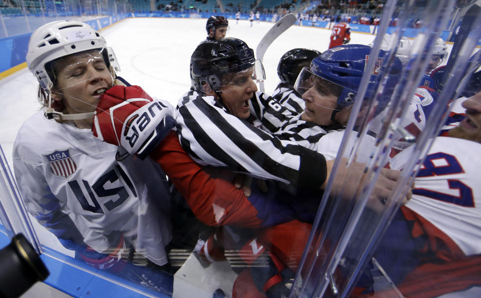 <p>Referees break up fight between the United States and the Czech Republic players during the first period of the quarterfinal round of the menâs hockey game at the 2018 Winter Olympics in Gangneung, South Korea, Wednesday, Feb. 21, 2018. (AP Photo/Matt Slocum) </p>